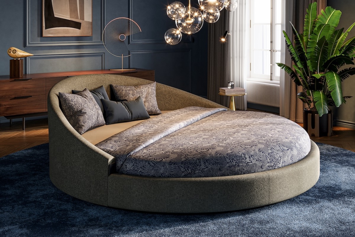 Het ronde bed van De Suite in lichte slaapkamer
